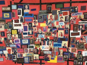 Many pieces of student artwork displayed.
