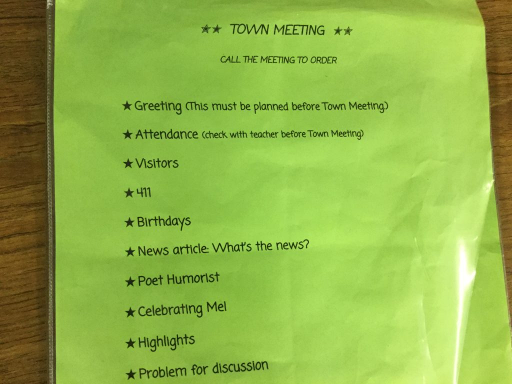 A clip board with an agenda on it.