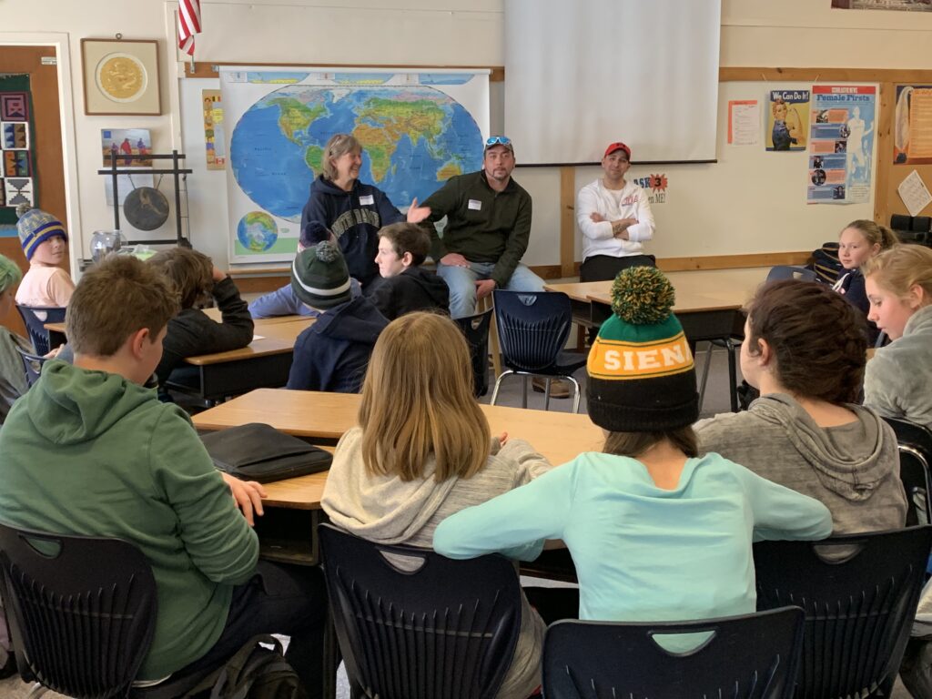 Rutland Dismas House director Terese Black and residents Jason and Travis talk to 6th grade students from the Dorset School.