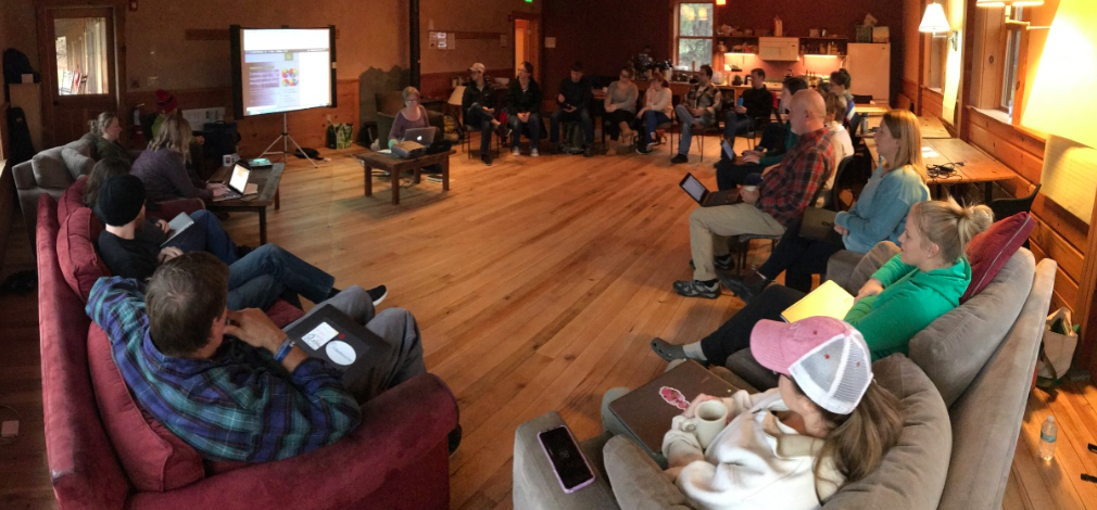 Learning Lab VT educators gathered at a lodge for a lecture on one of the overnight sessions