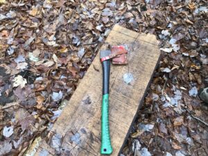 An axe on a split log