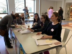 Welcome to Teen Lit Mob! Volunteers at the registration desk checked in attendees, handed out complimentary bags of books and helped with name tags.