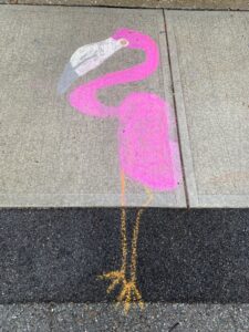 a flamingo drawn on a sidewalk