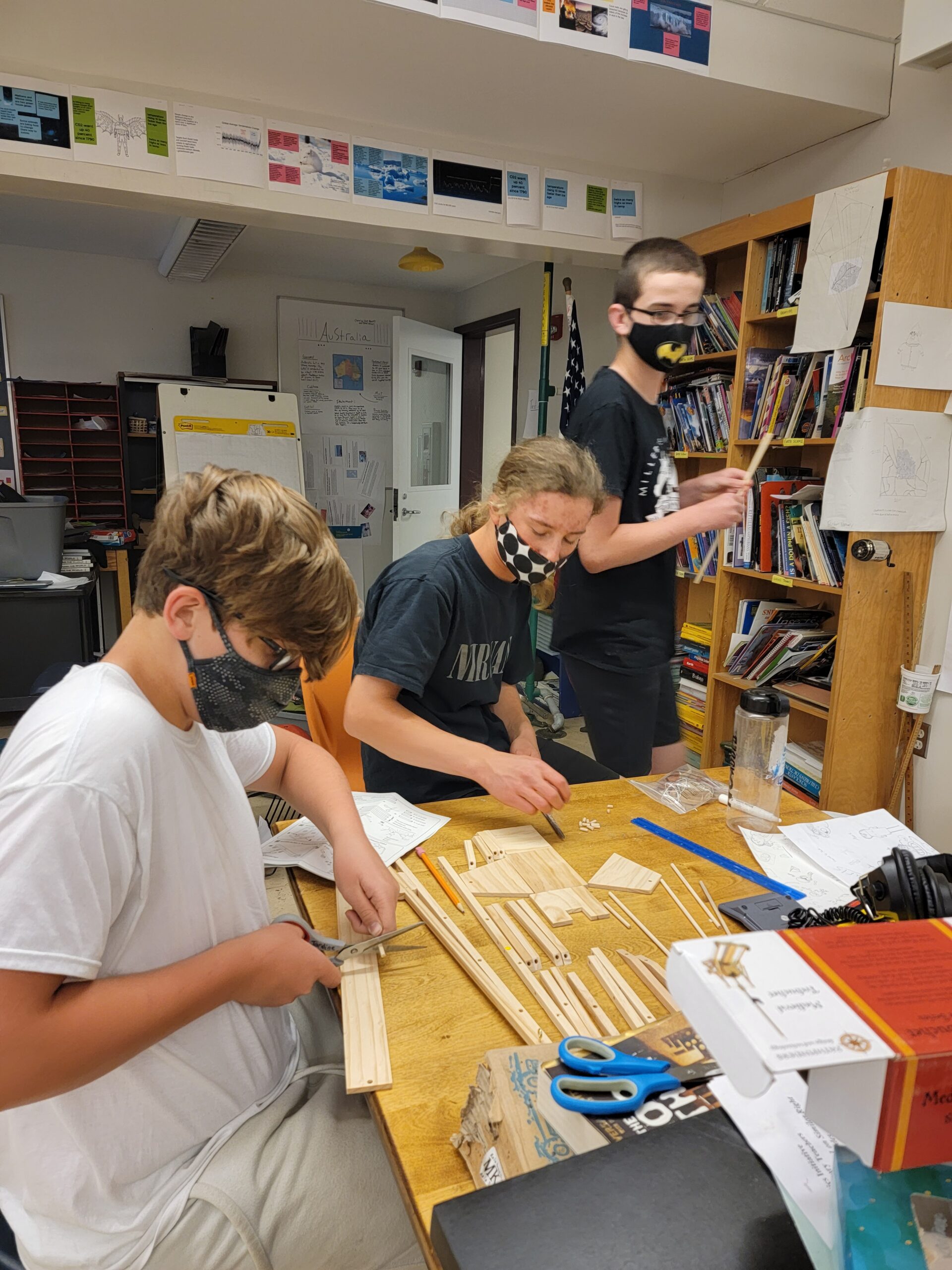 Some students work in a group and also sometimes wear masks