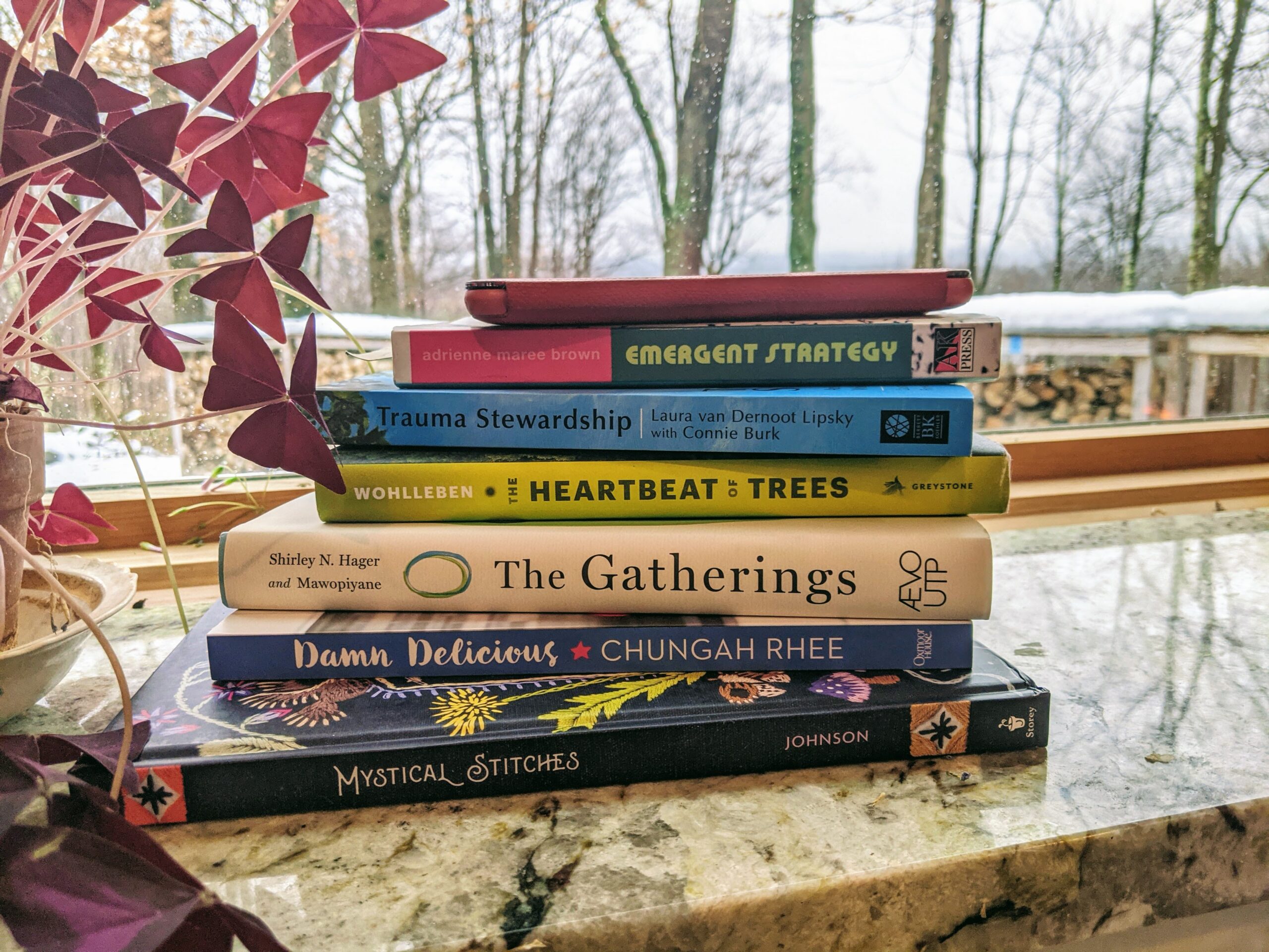 A pile of books on a marble table