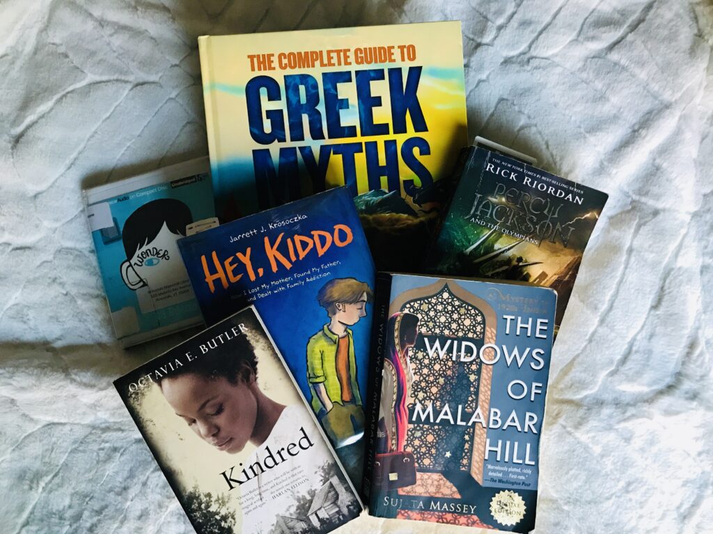 A pile of books on a blanket