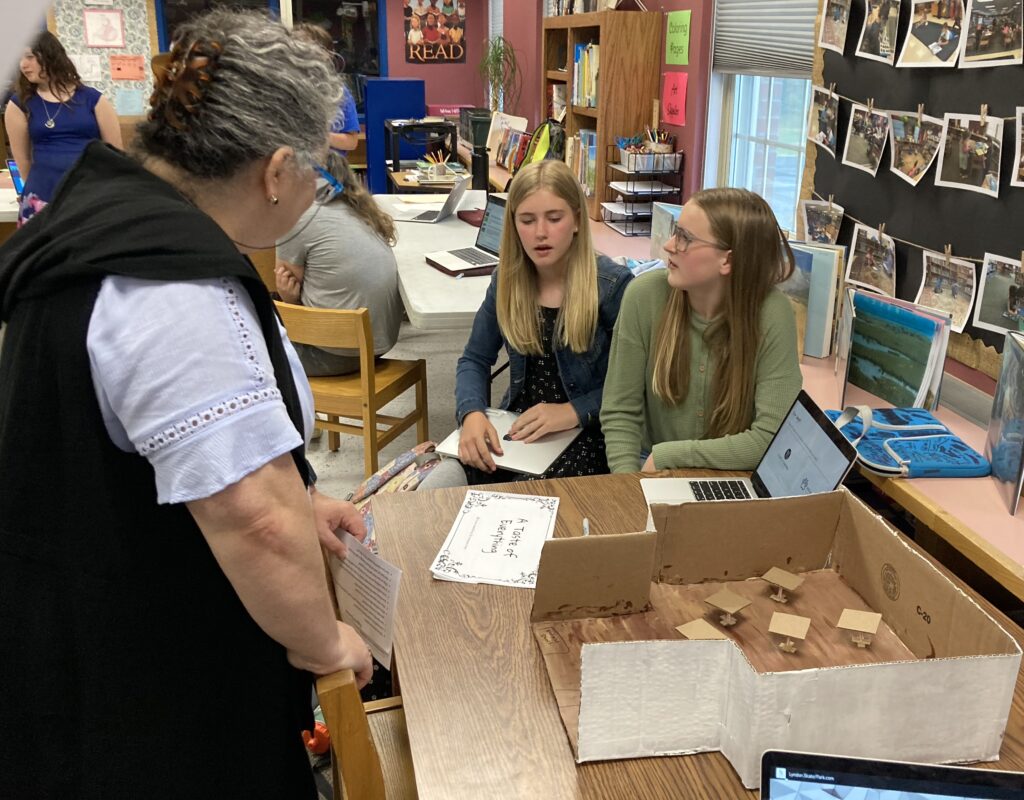 Students talk with a mentor