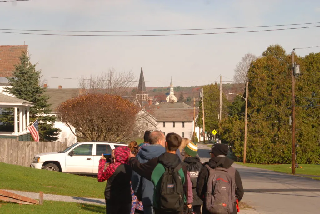 Students walking down a street in Vermont